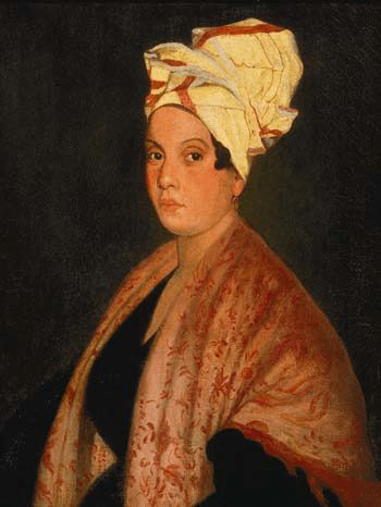 Ce tableau est un portrait de Marie Laveau. Elle est représentée de profil, portant une robe noire, avec un châle à motifs végétaux rouges couvrant ses épaules et un tissu blanc et rouge enveloppant ses cheveux.